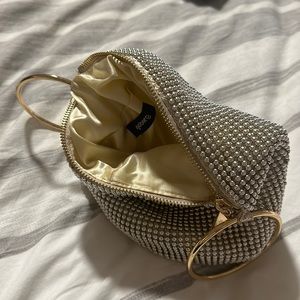 Gold clutch bag by Olga Berg